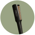 Close-up of a professional hair straightener, showcasing its sleek design and high-quality materials.
